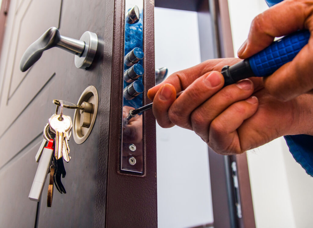 Rapid Locksmiths repairs the door lock