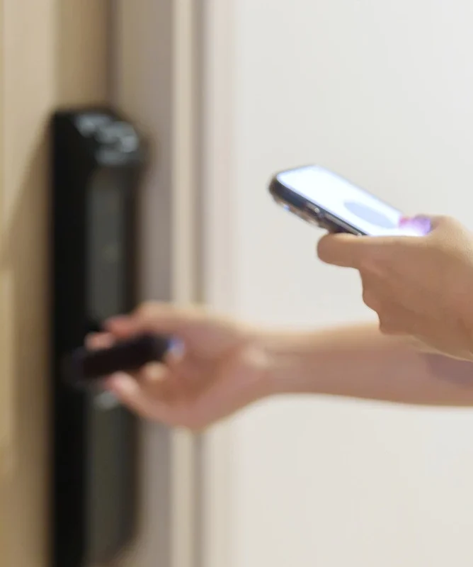 Modern smartphone-controlled smart lock from Rapid Locksmiths being accessed via a mobile app for keyless entry